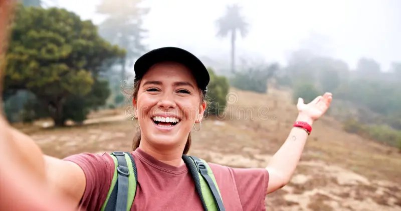 hiking-selfie-smile-woman-nature-social-media-post-travel-adventure-photography-trekking-environment-373791410